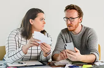 content couple reviewing credit