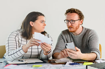 content couple reviewing credit