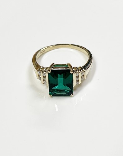 Synthetic Emerald 4 Claw Set With Diamonds Channel Set In Two Rows ...