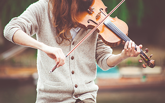 RS BLOG - Handy guide to buying second hand instruments - girl playing violin_RESIZED.png