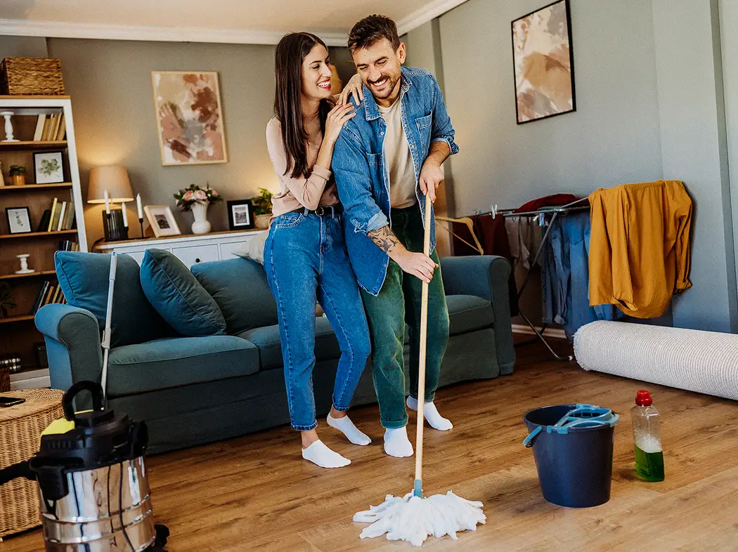Couple cleaning house
