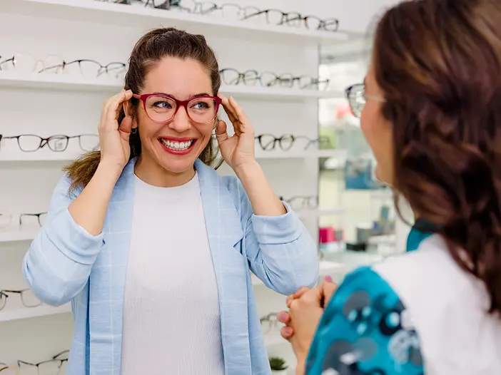 Woman trying on glasses